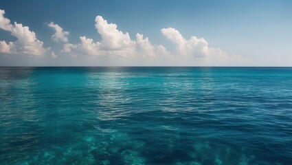 Obraz premium Stunning ocean view with calm blue waters, serene atmosphere, and fluffy clouds in sky creating a tranquil, peaceful setting
