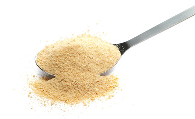 Pile biscuit crumbs in metal spoon, isolated on white, side view