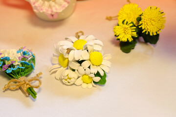 Original flowers made of polymer clay. The most realistic display. Soft focus. Close-up.