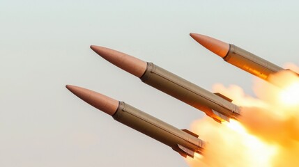 Naklejka premium Three Missiles Launching into Sky with Flames and Smoke Background