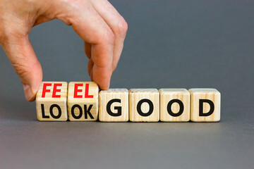 Look and feel good symbol. Concept words Look good Feel good on wooden cubes. Beautiful grey table grey background. Doctor hand. Healthy lifestyle look and feel good concept. Copy space.