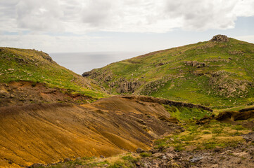 The majestic cliffs surrounded by blue waters. Vereda da Ponta de Sao Lourenco, Madeira, Portugal