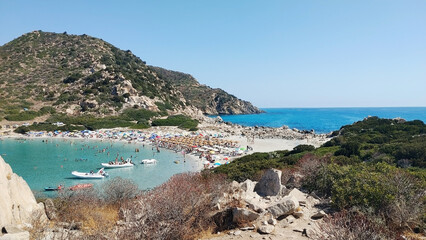 Beach in Villasimius, Cagliari, on the southeast tip of Sardinia Island, Italy. The idyllic isthmus of Punta Molentis with white sand and stones of the old granite quarry.