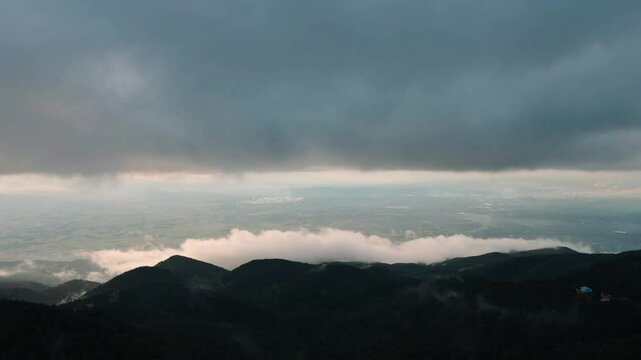 Aerial mystical view of clouds descending on a village between the mountains in Sakarya