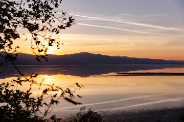 Beautiful sunset scenery on Kerkini lake Macedonia Greece, golden hour and sunrise, water reflection, autumn leaves