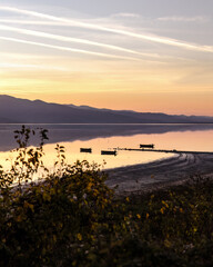 Fototapeta premium Beautiful sunset scenery on Kerkini lake Macedonia Greece, golden hour and sunrise, boats and water reflection, autumn leaves