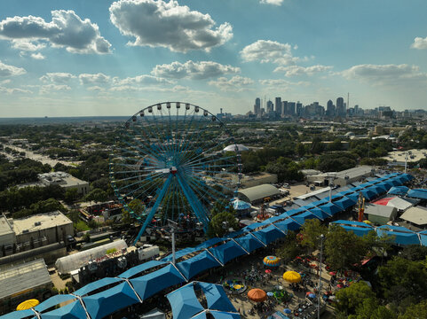 Aerial view of the Texas State Fair Ferris Wheel and the Dallas, Texas skyline