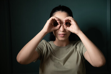 woman looking through binoculars