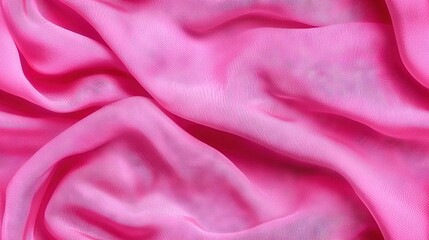 Fototapeta premium A pink fabric close-up with an abundance of light pink fabric below