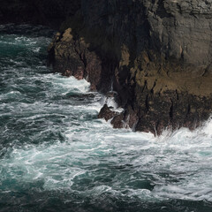Detail of the waves of the Atlantic Ocean crushing into the Kilkee Cliffs, Irland