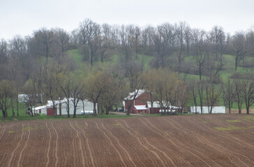 Fototapeta premium Countryside scenery, farm land and farm buildings.