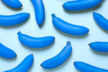 Blue bananas on light background, flat lay