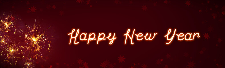 Naklejka premium New Year lettering with Bengal lights in the red night sky.