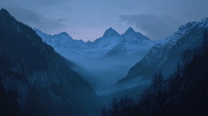 Misty mountain range at dusk.