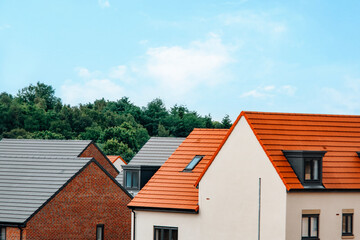 Modern architecture showcases vibrant rooftops in a peaceful residential area surrounded by greenery
