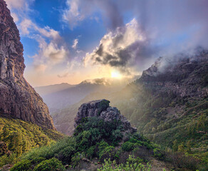 Picturesque sunset over mountains and green valley. Roque de Agando volcanic rock seen from Mirador...