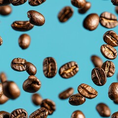 Fototapeta premium Coffee beans are rapidly falling against a striking blue backdrop, highlighting their glossy surface and unique shapes in motion