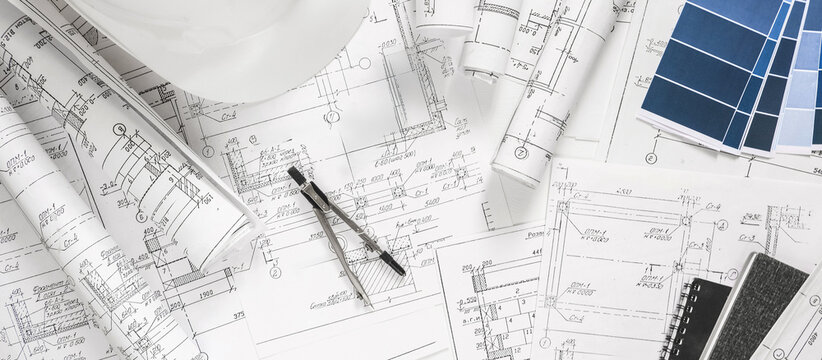 architect design working drawing sketch plans blueprints and making architectural construction model in architect studio,flat lay.