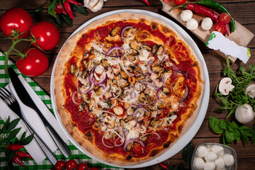 Pizza frutti di mare seafood, mozzarella mussels octopus squid, salmon, shrimp