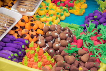 Traditional mexican christmas candies piled at a market stall, high angle view close-up.