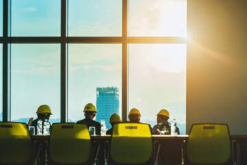 safety meeting on construction site, high-rise framework background