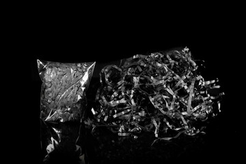 Naklejka premium Closeup decorative Shredded color craft tissue paper black background
