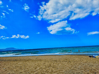 Dune at the sea shore, blue sky with white clouds, idyllic seascape. The waves swings in a paradisiac place. Sol, mar, onda, coqueiro, por do sol, alvorada, falsias, rio, nuvens, roda gigante.