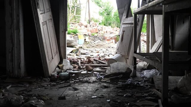 View to destroyed residential buildings at Kharkivska oblast. Ruined houses after bomb attacks on ukrainian territory from russia army. Consequences of russian invasion of Ukraine. Slow motion
