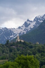 Beautiful landscape in the Alps. Mountain landscape with cloudy sky in summer in northern Italy. Mountain ranges and glaciers.