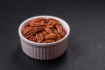 Delicious nutritious pecan nuts in ceramic bowl