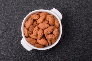Delicious nutritious almond nuts in ceramic bowl
