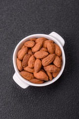 Delicious nutritious almond nuts in ceramic bowl