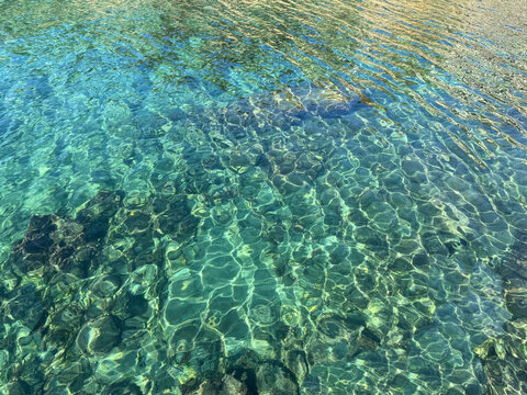 Mediterranean sea clear emerald water surface. 
