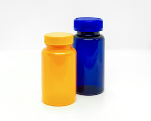 Yellow and blue plastic pill bottles. jar with lid for medicine or vitamins design. mockup