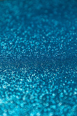 Blue glitter background texture. Concept: Crafts, party, decoration.