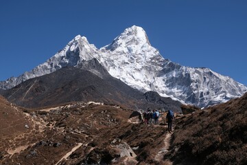 Amazing scenery of trekking to Ama Dablam Base Camp from Dingboche with little silhouettes of...