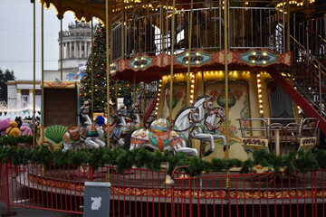 carousel attraction in winter country on weekends