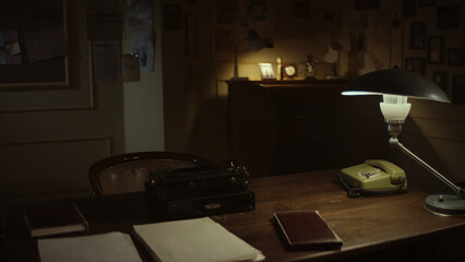 Vintage desk with typewriter, telephone and lamp