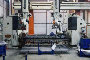 Industrial robot for welding metal parts