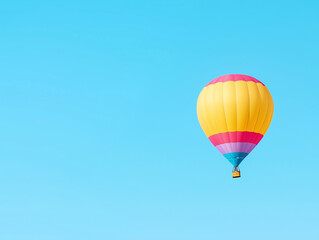 Fototapeta premium Serene Balloon Floating Serenely in a Clear Blue Sky