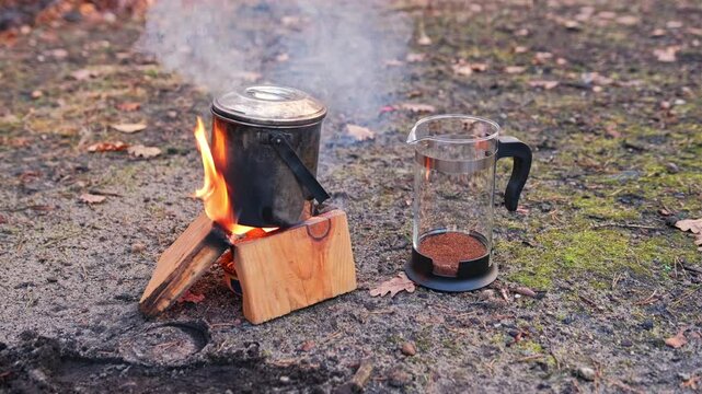 Water Boiled on Improvised Camp Paraffin Wax and Corrugated Paper Box Stove Buddy Burner for Brewing Grinded Ground Coffee using French Press Jug