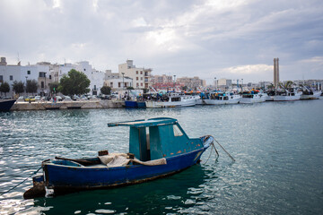 Fototapeta premium Old sailor boat in the Monopoli port in South Italy