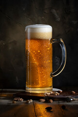 Glass of beer on a wooden table