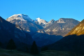 Obraz premium View of Tošc and Draški Vrh mountain peaks above Voje valley in Gorenjska, Slovenia