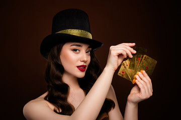 Photo of rich wealthy attractive lady playing poker cards isolated on brown color background