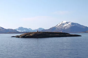 Fotobehang Rodoy, Helgeland, Nordland, Norway, April 2019. Norwegian island Vikingen with globe statue marking polar circle. Arctic Circle is an imaginary line of latitude that circles Earth's  northernmost poin © Koapan