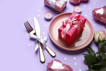 Beautiful table setting for Valentine's Day with pink roses, gifts and balloons on lilac background