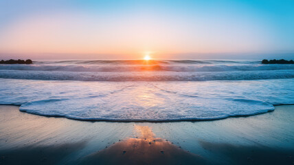 Obraz premium A serene sunrise over calm ocean waves, casting a warm glow on the sandy shore, creating a tranquil and peaceful beach scene.