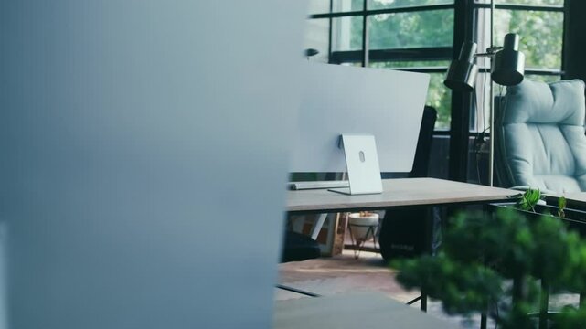 Modern Open Workspace with Natural Light and Minimalist Design Enriched with Vibrant Greenery