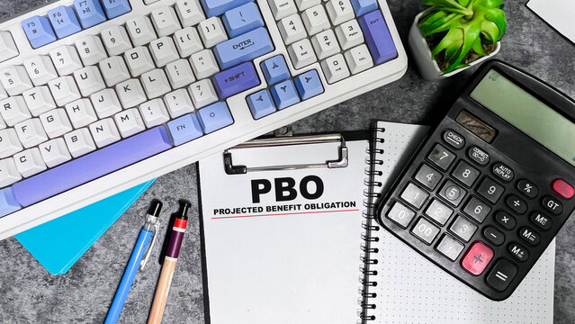 Concept of PBO - Projected Benefit Obligation write on paperwork isolated on Wooden Table.